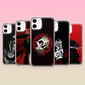May include: A collection of five phone cases with various black and red graphic designs. The designs include illustrations of characters with detailed features and text. The cases are displayed against a pink gradient background.