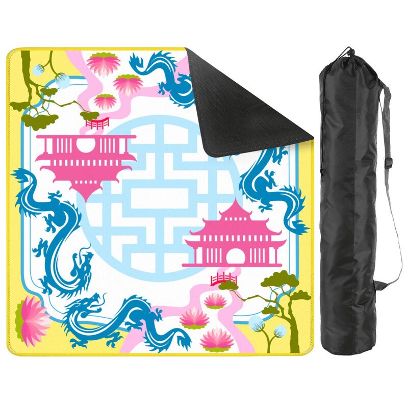 May include: A yoga mat with a colorful Asian-inspired design. The mat features blue dragons, pink pagodas, and lotus flowers on a yellow and white background. A black carrying bag is included.