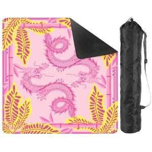 May include: Pink yoga mat with a dragon design and a black carrying bag. The mat features a repeating pattern of pink dragons, yellow leaves, and bamboo stalks. The bag is black with a shoulder strap.