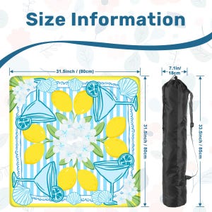 May include: A beach blanket with a lemon and cocktail design, measuring 31.5 inches (80 cm) square. The blanket has a blue and white striped background with yellow lemons, cocktail glasses, and seashell accents. Includes a black carrying bag, 33.5 inches (85 cm) long.