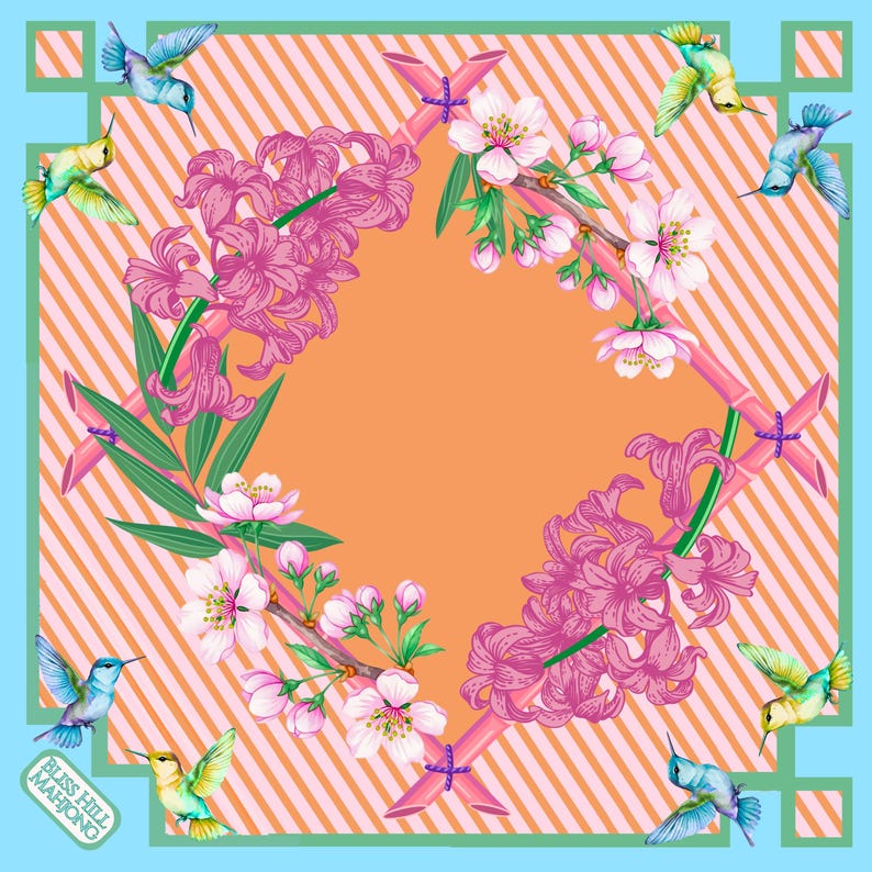 May include: A square scarf featuring a peach and white diagonal striped background with a light blue border. The design includes pink hyacinth flowers, cherry blossoms, and six hummingbirds in flight, with bamboo-style framing and the text BLISS HILL MAHJONG.