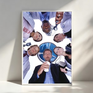 May include: A framed print featuring a group of people looking down from above. The people are dressed in professional attire, including lab coats and suits. The central figure holds a coffee cup. The background includes a medical symbol.