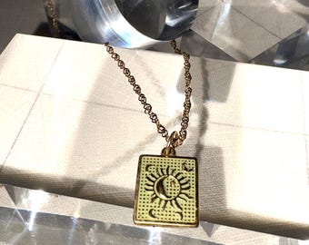 Sun and moon celestial pendant necklace in 18k gold plated stainless steel
