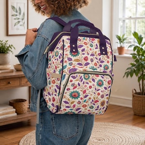 Mochila cambiador con estampado floral / Nylon resistente, correas acolchadas, múltiples bolsillos