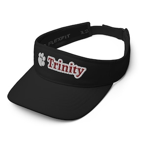 May include: Black Flexfit visor with the word "Trinity" embroidered in red and white. A white paw print is on the left side of the visor. The visor has a curved brim and an adjustable strap.