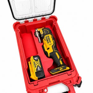 May include: A red Packout case with a clear lid, containing a yellow and black oscillating multi-tool and a 20V battery. The tool and battery are branded with the DeWalt logo. The case is open, revealing the interior compartments.