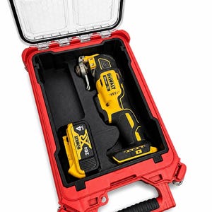 May include: A red and black tool case with a clear lid, containing a yellow and black oscillating multi-tool and a 20V battery. The case has a black handle and is designed for tool storage and transport.