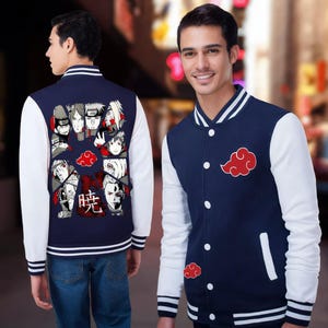 May include: A navy blue and white varsity jacket featuring a red cloud graphic on the front and a back panel displaying multiple anime character portraits arranged in a circular pattern with the Japanese kanji character for Akatsuki in red.