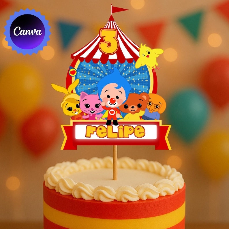 May include: A colorful cake topper featuring a circus tent design with the number 3 and the name "Felipe". The topper includes cartoon characters and is placed on top of a cake with red, yellow, and white frosting.