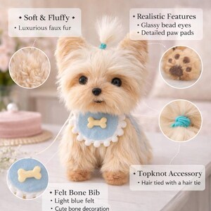May include: A plush, tan-colored dog with a light blue felt bone bib and a topknot secured with a turquoise hair tie. The dog features glassy bead eyes and detailed paw pads. The image highlights the soft, fluffy faux fur.