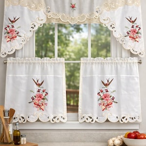 May include: White kitchen curtains with a floral and bird embroidery design. The curtains feature a scalloped edge and a valance with a matching design. The embroidery includes pink roses, butterflies, and a bird.