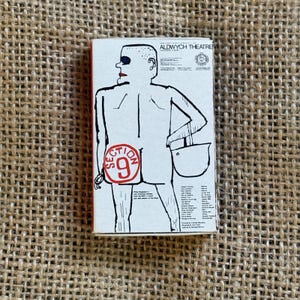 May include: A rectangular, vintage Aldwych Theatre playbill featuring a stylized illustration of a figure with red lips and the text "SECTION 9". The playbill has a white background with black and red accents.
