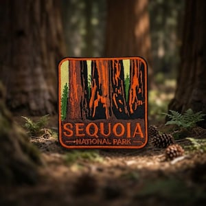 May include: A rectangular embroidered patch featuring a forest of tall, orange-brown sequoia trees against a light yellow sky. The text 'SEQUOIA' appears in large orange letters above the smaller text 'NATIONAL PARK' in a black border.