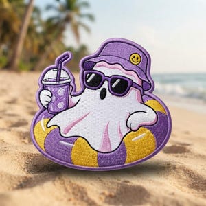 May include: An embroidered patch featuring a white ghost wearing a purple bucket hat with a yellow smiley face, black sunglasses, and holding a purple drink. The ghost is floating in a yellow and purple striped inflatable pool ring.