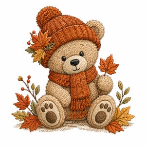 May include: An embroidered illustration of a light brown teddy bear wearing a burnt orange knit beanie with a pom-pom and a matching fringed scarf. The bear is surrounded by autumn maple leaves and small berry sprigs in shades of orange and gold.