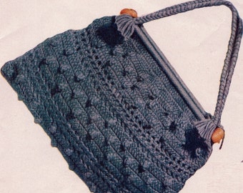 May include: A blue crocheted handbag with wooden handles. The bag has a textured pattern and a woven design.