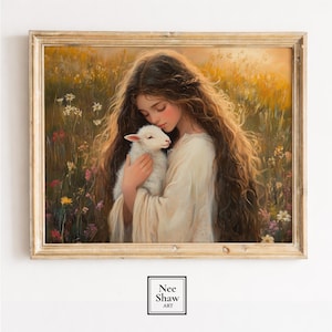 Puede incluir: Una pintura enmarcada representa a una persona joven con cabello castaño largo sosteniendo tiernamente un cordero blanco en un campo de flores silvestres. La obra de arte está en un marco de color dorado y tiene una paleta de colores suave y cálida. El nombre del artista, "Nee Shaw Art", está en la esquina inferior derecha.
