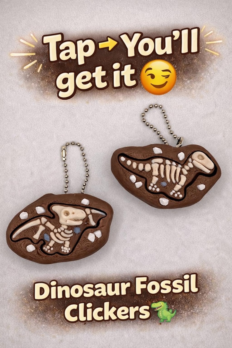 Peut inclure: Deux clickers fossiles de dinosaures bruns avec des d&eacute;tails d'os blancs et des porte-cl&eacute;s &agrave; cha&icirc;ne argent&eacute;e. Le texte "Tap -> You'll get it" est en haut et "Dinosaur Fossil Clickers" en bas.