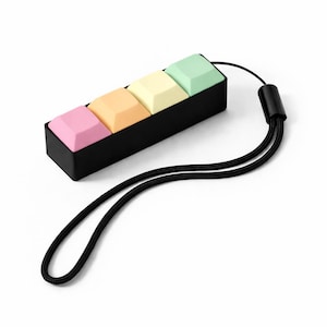 May include: A set of three ceramic mugs with a speckled, matte finish. The mugs are in shades of cream, light gray, and dark gray. Each mug has a simple, minimalist design, perfect for coffee or tea.