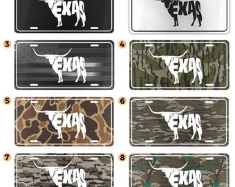 May include: License plates with a Texas theme. The plates feature a longhorn silhouette and the word "TEXAS" in white. Various designs include black, white, camouflage, and a Texas flag.