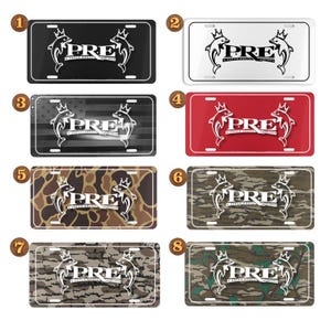 Puede incluir: Placas de matrícula con un diseño de delfín y la palabra "PRE" en varios colores y patrones. Las placas incluyen negro, blanco, rojo, camuflaje y un diseño con la bandera americana.