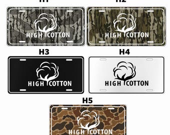 May include: License plates with the text "HIGH COTTON" and a cotton plant graphic. The plates feature various camouflage patterns, black, and white backgrounds. The plates are rectangular with a white border.