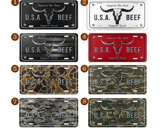 May include: License plates with a bull skull design and the words "U.S.A. BEEF" and "Support Local." The plates come in various colors and patterns, including black, white, red, camouflage, and a design resembling the American flag.