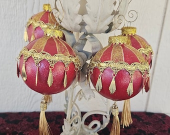 Large red and gold Christmas ornaments with feathery metal dangles and gold tassels.  A real standout for your tree or gifted to friends.