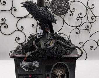 Goth / Halloween themed jewelry box with candle-carrying raven with flickering flame, caged skull and vampire bat pulls.