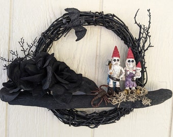 Cute little skeleton gnome family on 10" black wreath - great Halloween decoration or collectible for gnome lovers.