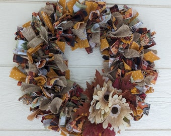 Fall themed rag wreath, perfect for Thanksgiving.  Nice way to greet the family at the door or to grace the wall in the dining room.