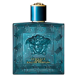 May include: A turquoise Versace Eros Eau de Parfum bottle. The square bottle features a geometric pattern and a Medusa head emblem. The cap is teal with a gold top. The text "VERSACE EROS EAU DE PARFUM" is printed on the front.