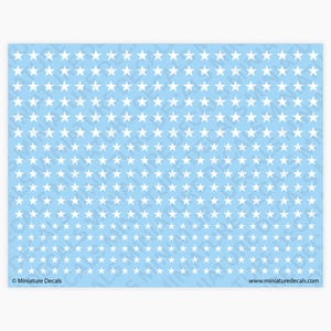 May include: A sheet of miniature decals featuring a repeating pattern of white stars on a light blue background. The text "Miniature Decals" and "www.miniaturedecals.com" are visible.