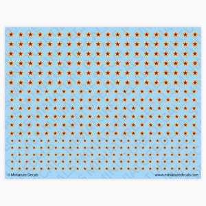 May include: A sheet of miniature decals with a repeating pattern of red stars with yellow borders on a light blue background. The text "Miniature Decals" and a website address are visible.