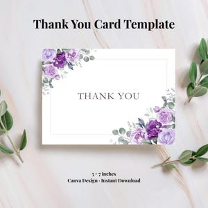 May include: A rectangular thank you card template measuring 5 by 7 inches with a white background. The design features watercolour purple and lavender roses with green eucalyptus leaves in the top-left and bottom-right corners. The text THANK YOU is centred.