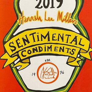 May include: A red booklet featuring a green and yellow illustration of a Russian nesting doll. The doll displays the text "Sentimental Condiments" and "Hannah Lee Miller's". The year "2019" is written in white on the doll's head. The text "original recipes" is written above the year. The text "est. 1976" is written below the doll.
