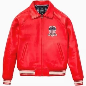 May include: A vibrant red leather jacket with a classic bomber style. Features a collared neckline, a front zipper, and two front pockets. The cuffs and hem have a white and red striped design. An embroidered patch is on the left chest.