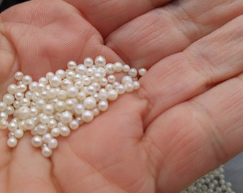 May include: A handful of white pearl beads, perfect for jewelry making or crafting.