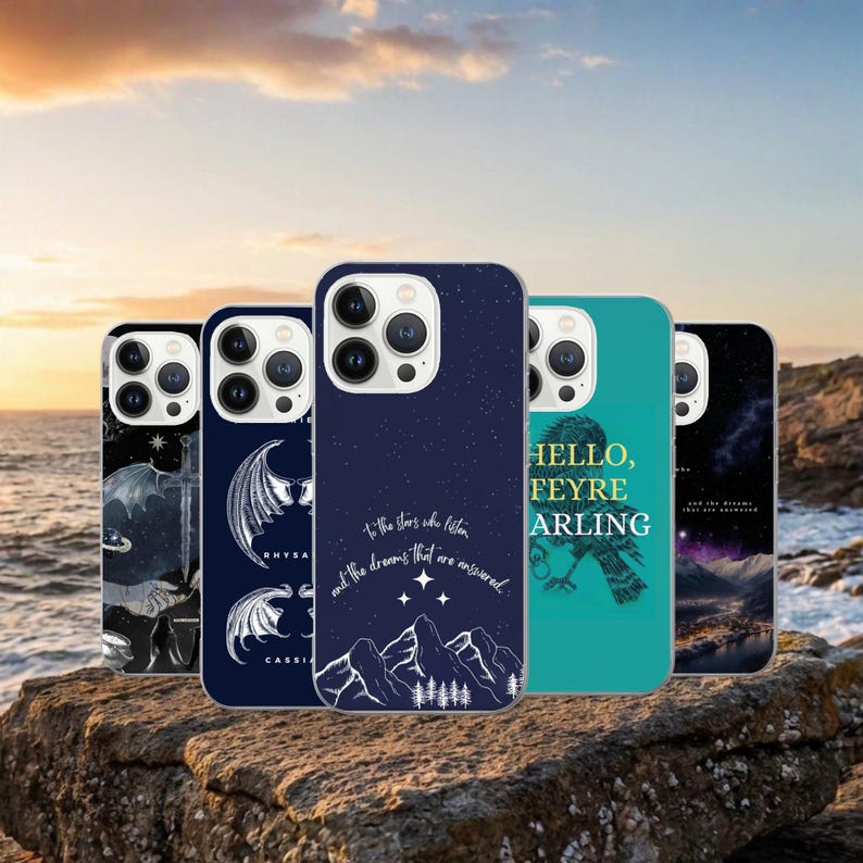 May include: A collection of five phone cases with various designs. One case features a dark blue starry night design with text. Another has a teal background with a bird and text. Other cases have illustrations of wings and other graphics.