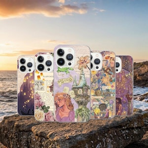May include: Five phone cases with different designs featuring illustrations and text. The cases have a purple, pink, and yellow color scheme. The designs include a castle, a woman with long hair, and floating lanterns. The cases are on a rock.