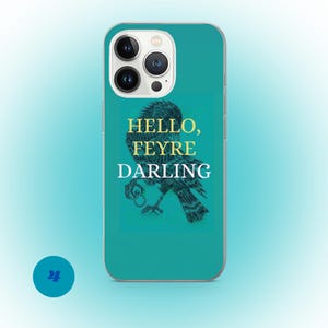May include: A teal phone case featuring a detailed illustration of a bird with the text "HELLO, FEYRE DARLING" in gold and white. The phone case has a camera cutout and a teal background.