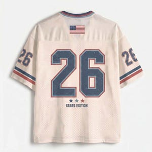 May include: A cream-coloured mesh jersey featuring the number 26 in large navy blue font with a red outline on the back. The shirt includes a small American flag graphic at the neckline, the text STARS EDITION with three stars, and the number 26 on sleeves.