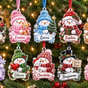 May include: A collection of ten personalized snowman ornaments hanging from ribbons. Each snowman features unique accessories like hats, scarves, and items such as a lantern, teddy bear, tree, gift, gingerbread man, heart, or sign reading Let it Snow.