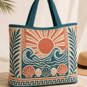 May include: A rectangular crochet tote bag featuring a teal handle and trim. The front panel displays a woven design of a rising orange sun over blue ocean waves, with a row of seashells at the bottom and vertical fern-like leaves on the sides.