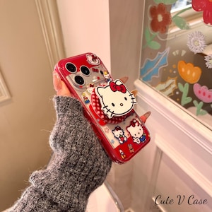 鮮やかなレッドのハローキティ マルチデザイン クリアマグネット式スマホケース、お揃いのポップソケットスタンド付き、MagSafe対応 iPhone 15/16/17 Pro Max対応 画像 6