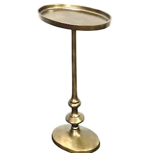 May include: A gold-toned metal side table featuring an oval top and base. The table has a decorative stem with a bulbous design. The height is approximately 61 cm.