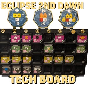 May include: A black plastic board game organiser for Eclipse 2nd Dawn, featuring a grid of slots holding various square technology tiles with icons and text. Three hexagonal markers with numerical values are attached to the top edge of the board.