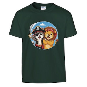 May include: Dark green t-shirt featuring a cartoon illustration of a pirate cat holding a sword and a lion wearing a red bandana. The cat has a pirate hat and eye patch. The lion has its arms crossed. The design is in a blue circle.