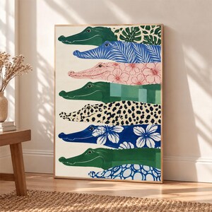 May include: A vertical wall art print featuring seven stacked crocodile silhouettes in a variety of patterns and colors, including solid green, blue with white floral motifs, pink with hibiscus flowers, green checkered, leopard print, and blue circles.
