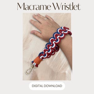 May include: A macrame wristlet featuring a braided pattern in red, white, and blue cord. The wristlet includes an orange cord wrap at the base and a gold-toned metal lobster clasp. The text Macrame Wristlet and DIGITAL DOWNLOAD are visible.